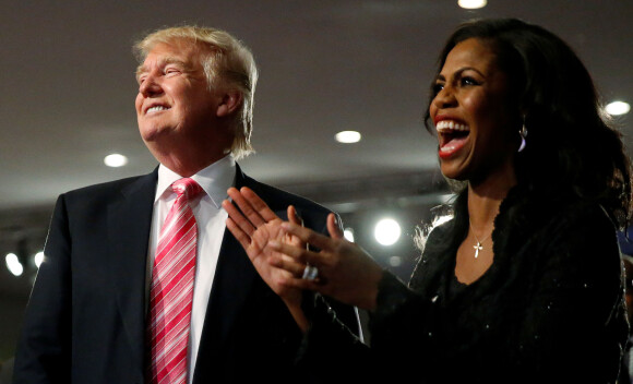 FILE PHOTO: Republican presidential nominee Donald Trump and Omarosa Manigault (R) attend a church service, in Detroit, Michigan, U.S., September 3 2016. REUTERS/Carlo Allegri/File Photo